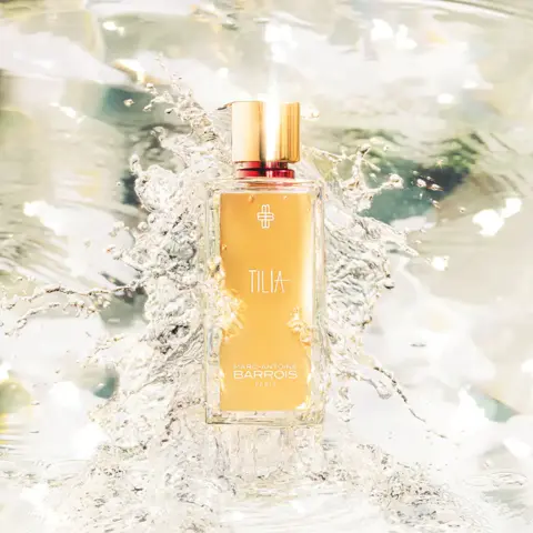 Tilia perfume bottle with gold cap in sparkling water