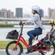 Rode elektrische plooifiets met kinderzitje