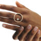 18 karat gold ring, in top view, consisting of an open circle set with diamonds and in the circle a freestanding diamond.